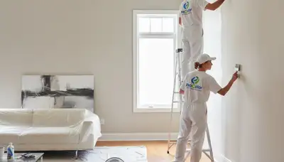 Professional interior house painters transforming a Newton MA living room with expert color finishes